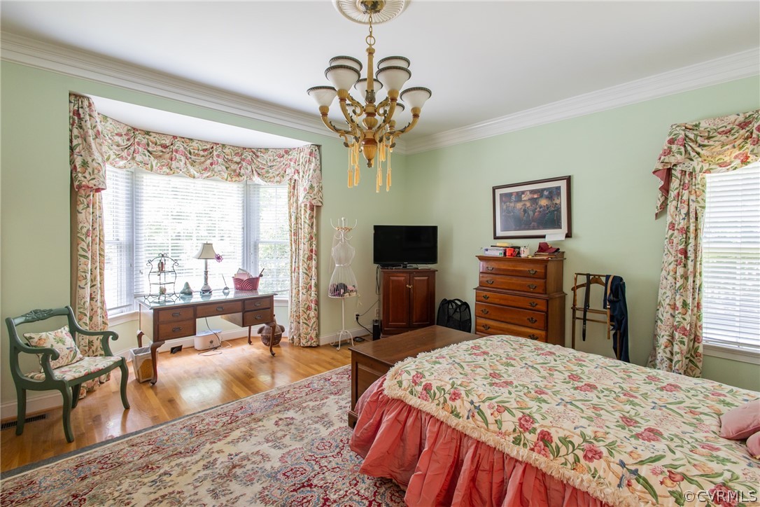 369 Hamlet Road Manakin-Sabot, VA 23103 - Photo 20 of 50 a bedroom with a bed and a chandelier