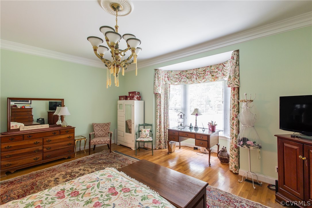 369 Hamlet Road Manakin-Sabot, VA 23103 - Photo 22 of 50 a bedroom with a bed and a chandelier