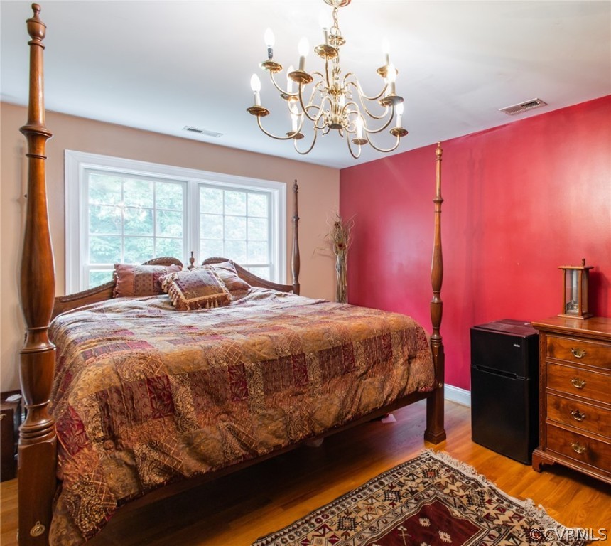 369 Hamlet Road Manakin-Sabot, VA 23103 - Photo 27 of 50 a bedroom with a bed chandelier and a window
