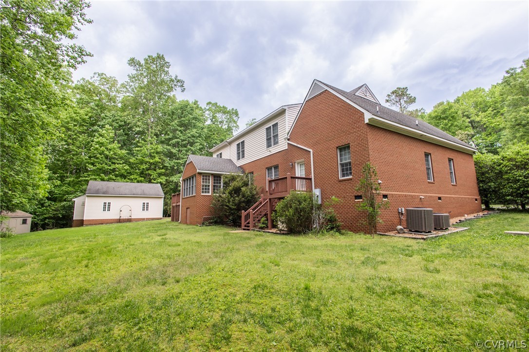 369 Hamlet Road Manakin-Sabot, VA 23103 - Photo 41 of 50 a view of a house with backyard and a tree