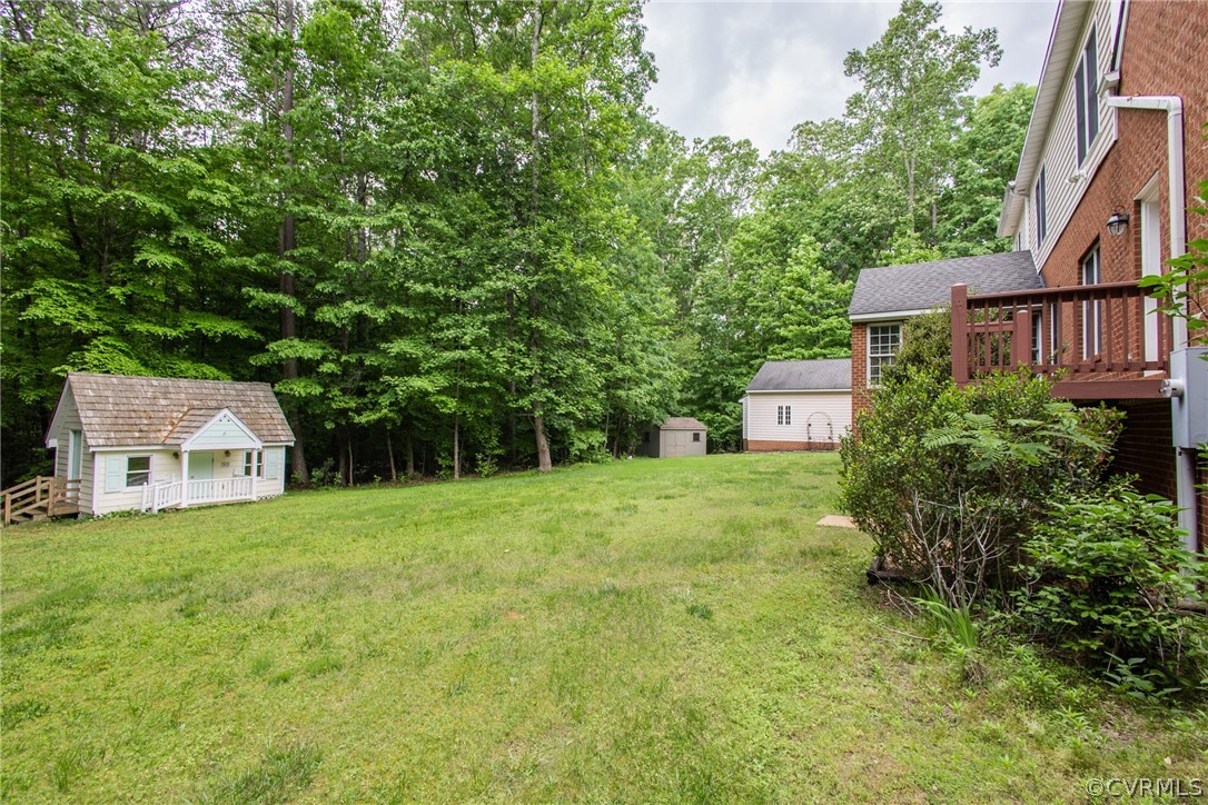 369 Hamlet Road Manakin-Sabot, VA 23103 - Photo 43 of 50 a view of a house with a yard and large trees