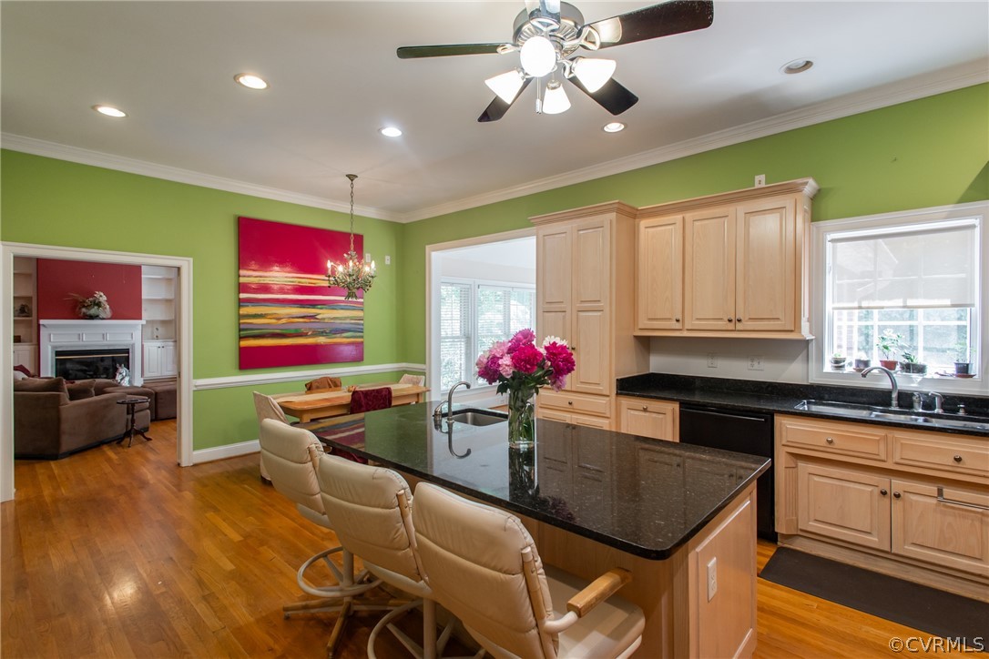 369 Hamlet Road Manakin-Sabot, VA 23103 - Photo 45 of 50 a kitchen with stainless steel appliances kitchen island granite countertop a dining table chairs refrigerator and sink