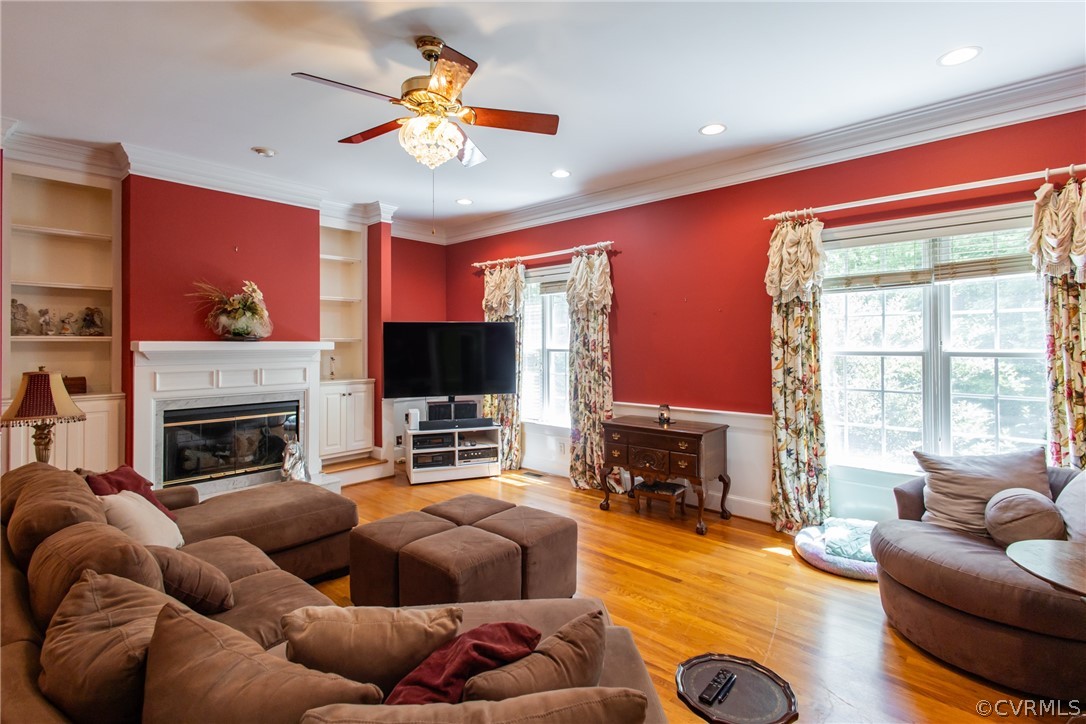 369 Hamlet Road Manakin-Sabot, VA 23103 - Photo 7 of 50 a living room with furniture a fireplace and a flat screen tv