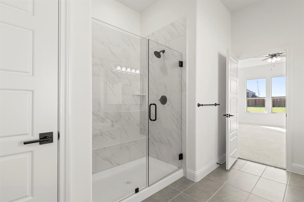 610 Tenor Drive Forney, TX 75126 - Photo 15 of 30 a bathroom with a shower