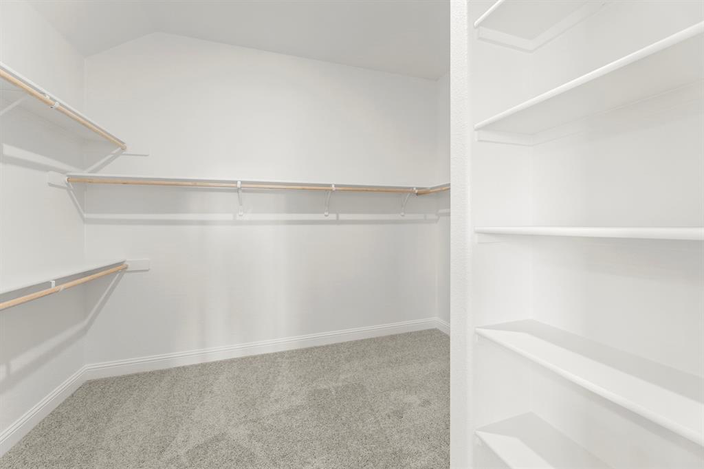 610 Tenor Drive Forney, TX 75126 - Photo 16 of 30 a view of an empty walk in closet