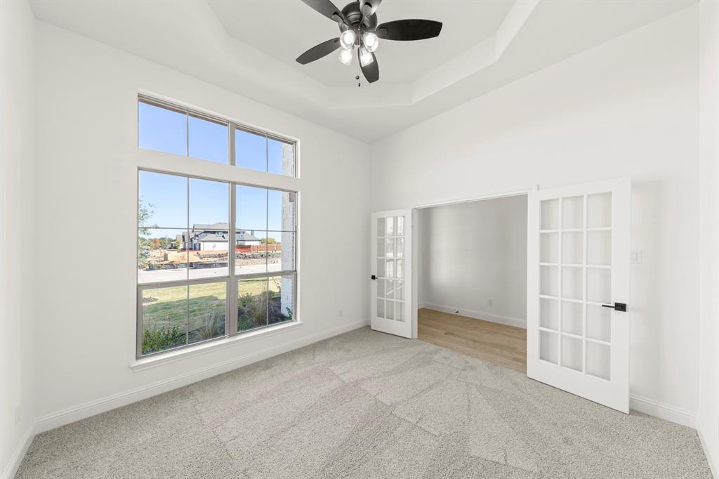 610 Tenor Drive Forney, TX 75126 - Photo 17 of 30 a view of an empty room with a window