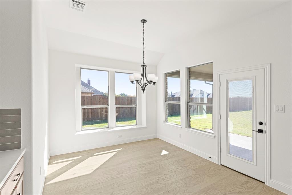 610 Tenor Drive Forney, TX 75126 - Photo 18 of 30 a view of an empty room with windows