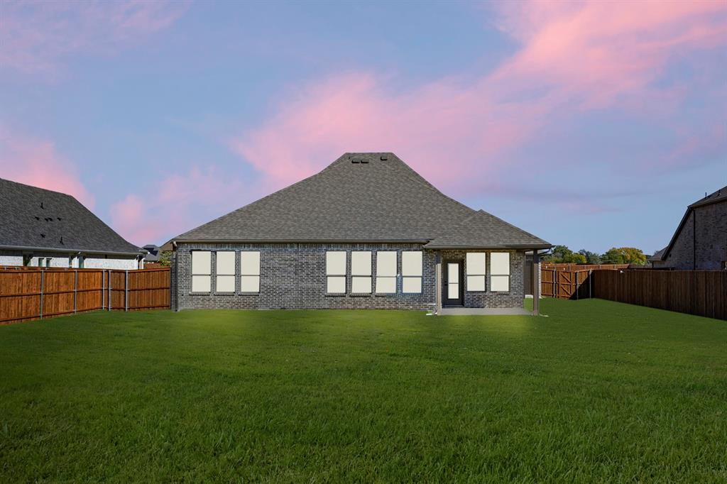 610 Tenor Drive Forney, TX 75126 - Photo 25 of 30 a front view of a house with a yard