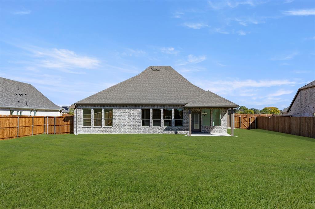 610 Tenor Drive Forney, TX 75126 - Photo 26 of 30 a view of a house with a yard and sitting area