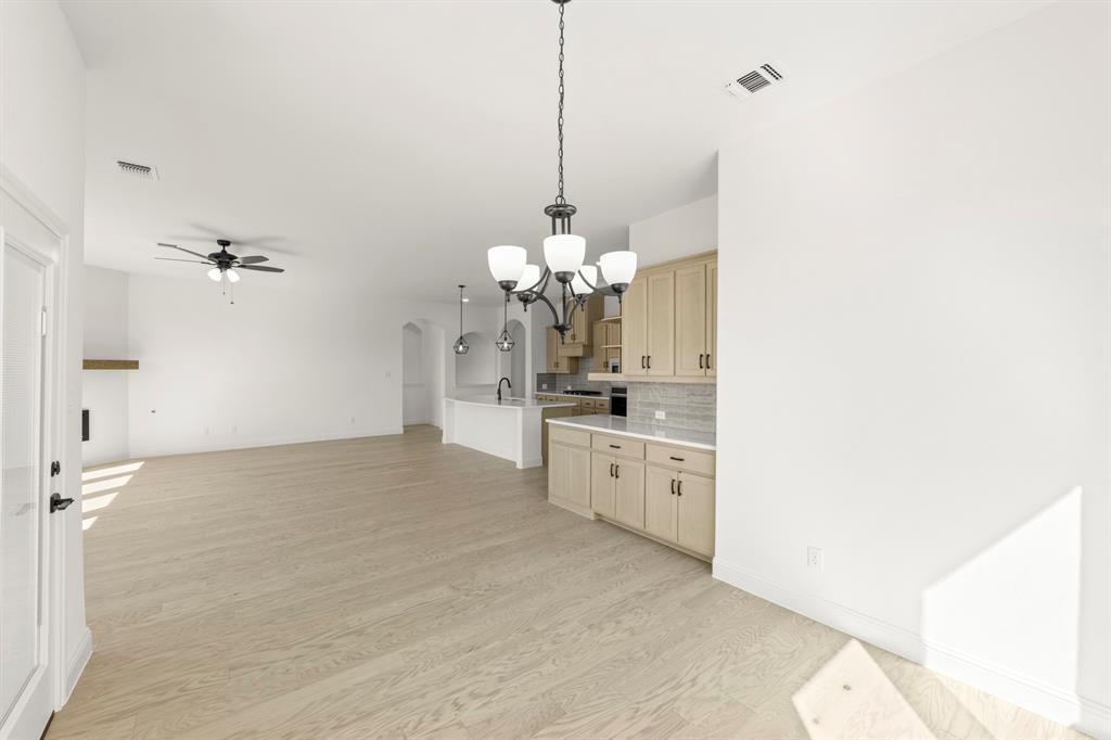 610 Tenor Drive Forney, TX 75126 - Photo 7 of 30 a view of a room with cabinet and a chandelier