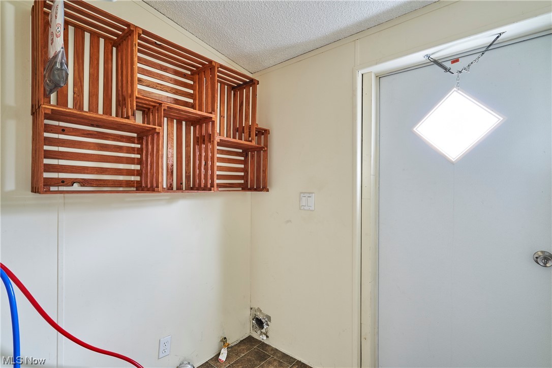 45 Eddie Road Madison, OH 44057 - Photo 21 of 26 Washroom featuring a textured ceiling