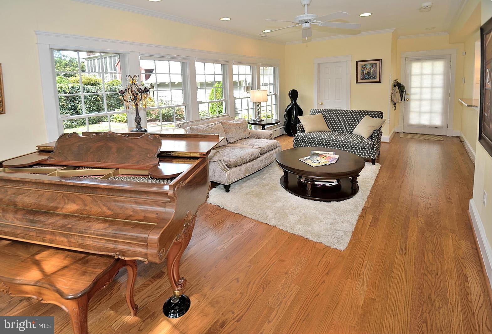 404 Russell Road Alexandria, VA 22301 - Photo 14 of 29 a living room with furniture and a floor to ceiling window