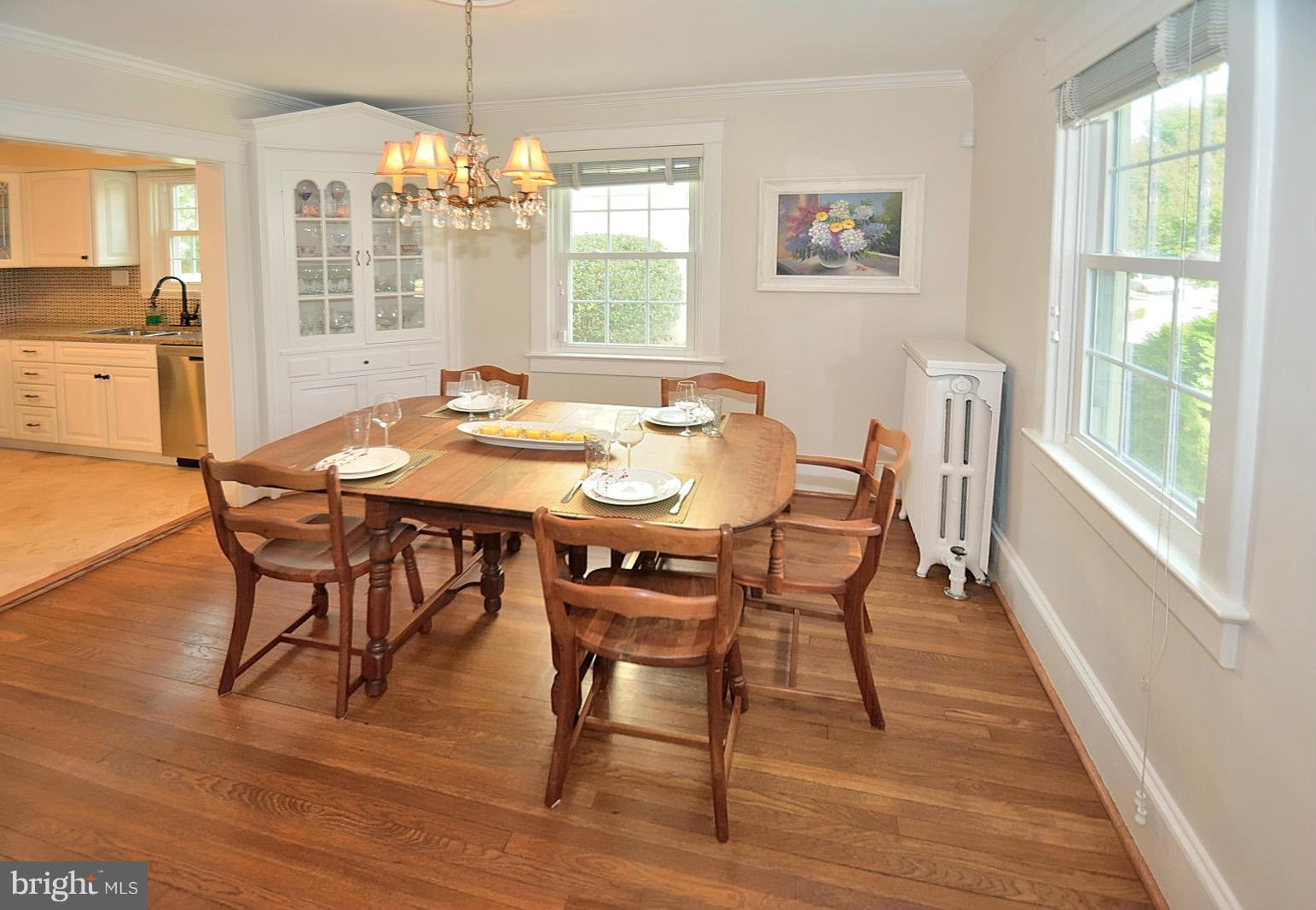404 Russell Road Alexandria, VA 22301 - Photo 3 of 29 a view of a dining room with furniture wooden floor and chandelier