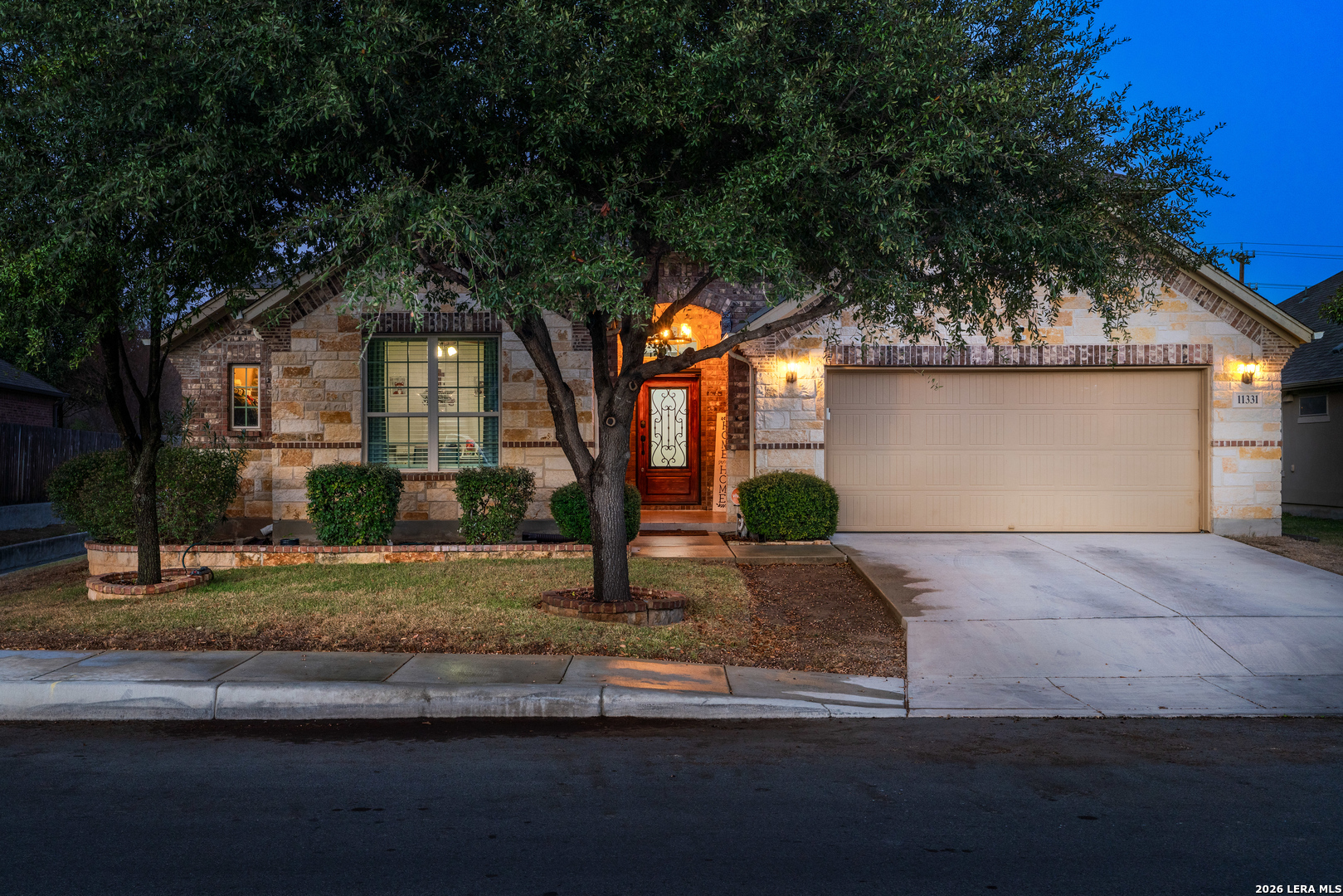 11331 Massive Mount Helotes, TX 78023 - Photo 1 of 43 a front view of a house with garage and windows
