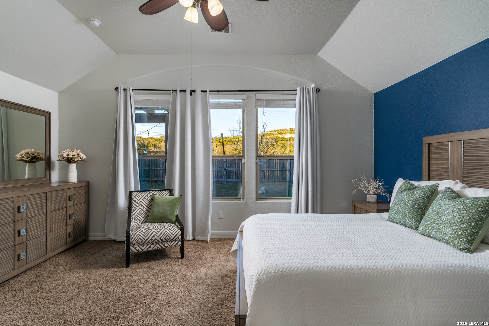 11331 Massive Mount Helotes, TX 78023 - Photo 16 of 43 a bedroom with a bed and a chandelier