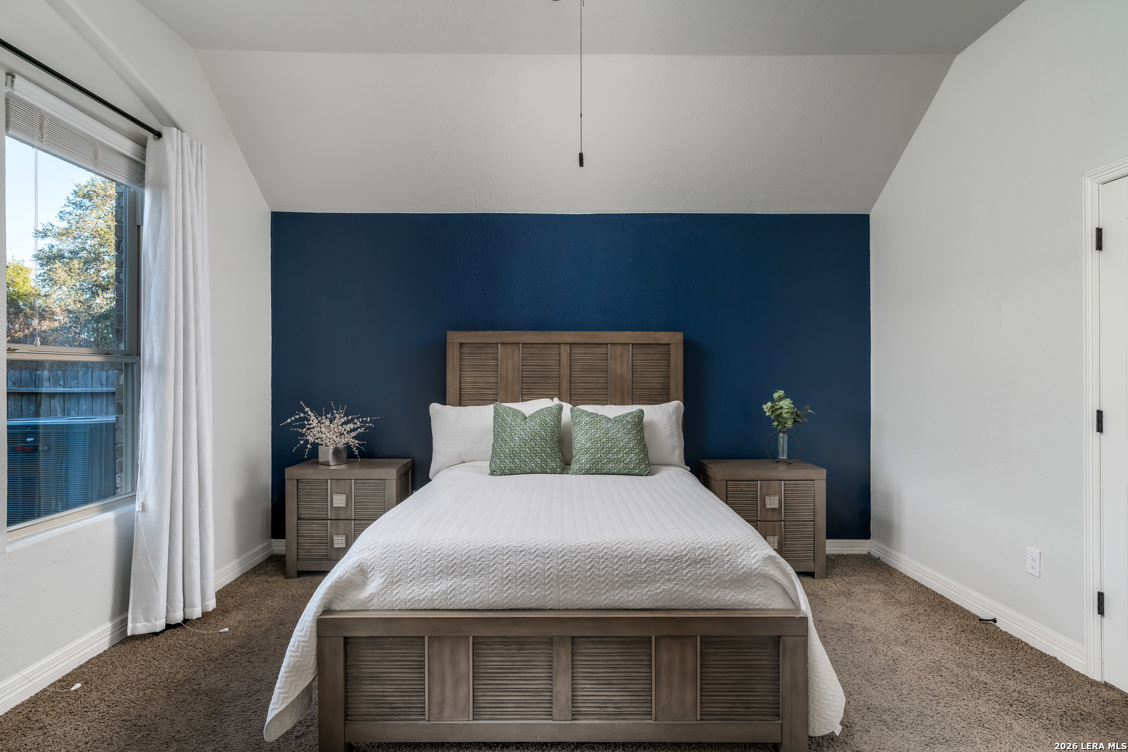 11331 Massive Mount Helotes, TX 78023 - Photo 17 of 43 a bed sitting in a bedroom next to a window