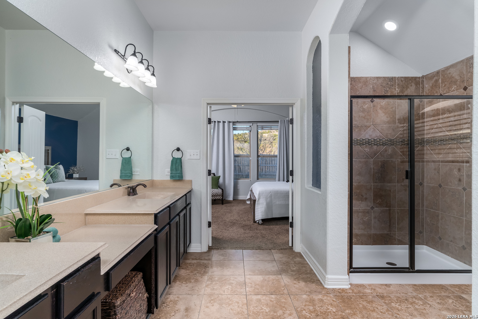 11331 Massive Mount Helotes, TX 78023 - Photo 19 of 43 a spacious bathroom with a granite countertop sink a mirror and a shower