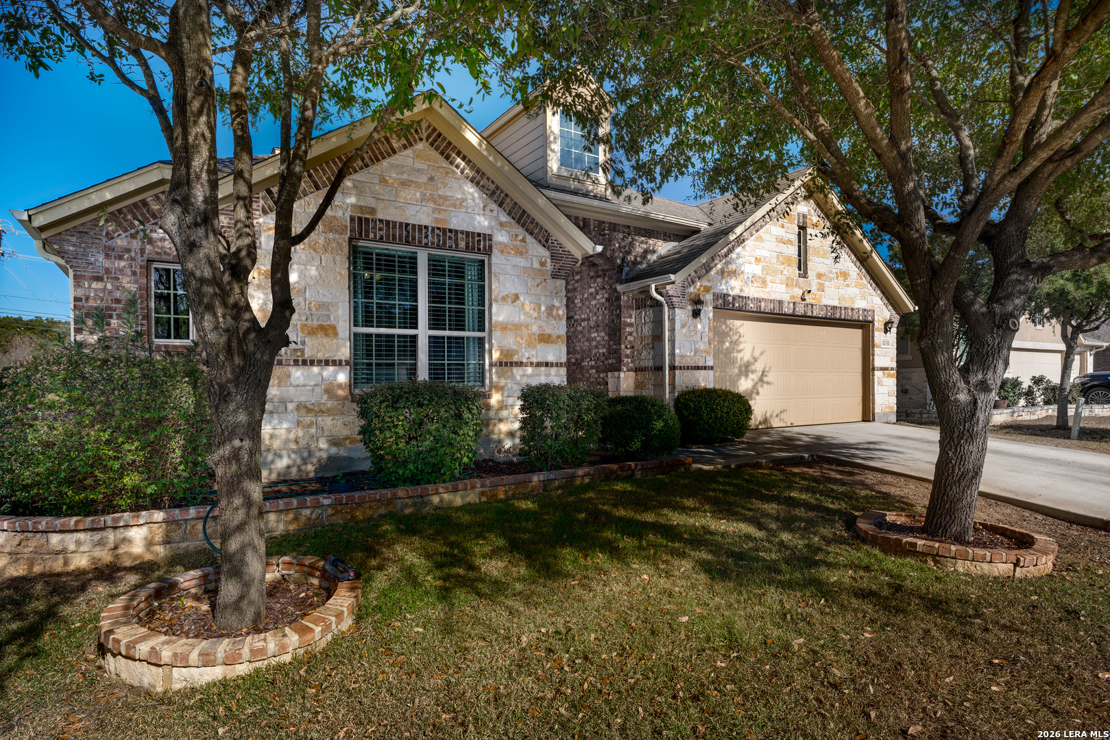 11331 Massive Mount Helotes, TX 78023 - Photo 2 of 43 a front view of a house with garden