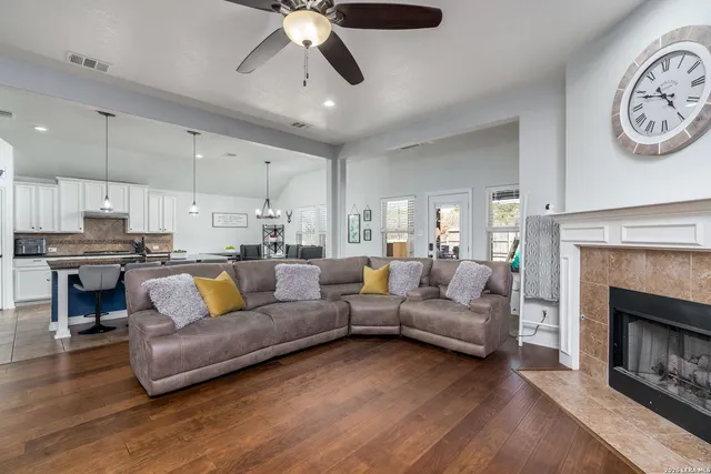 a living room with furniture and a fireplace