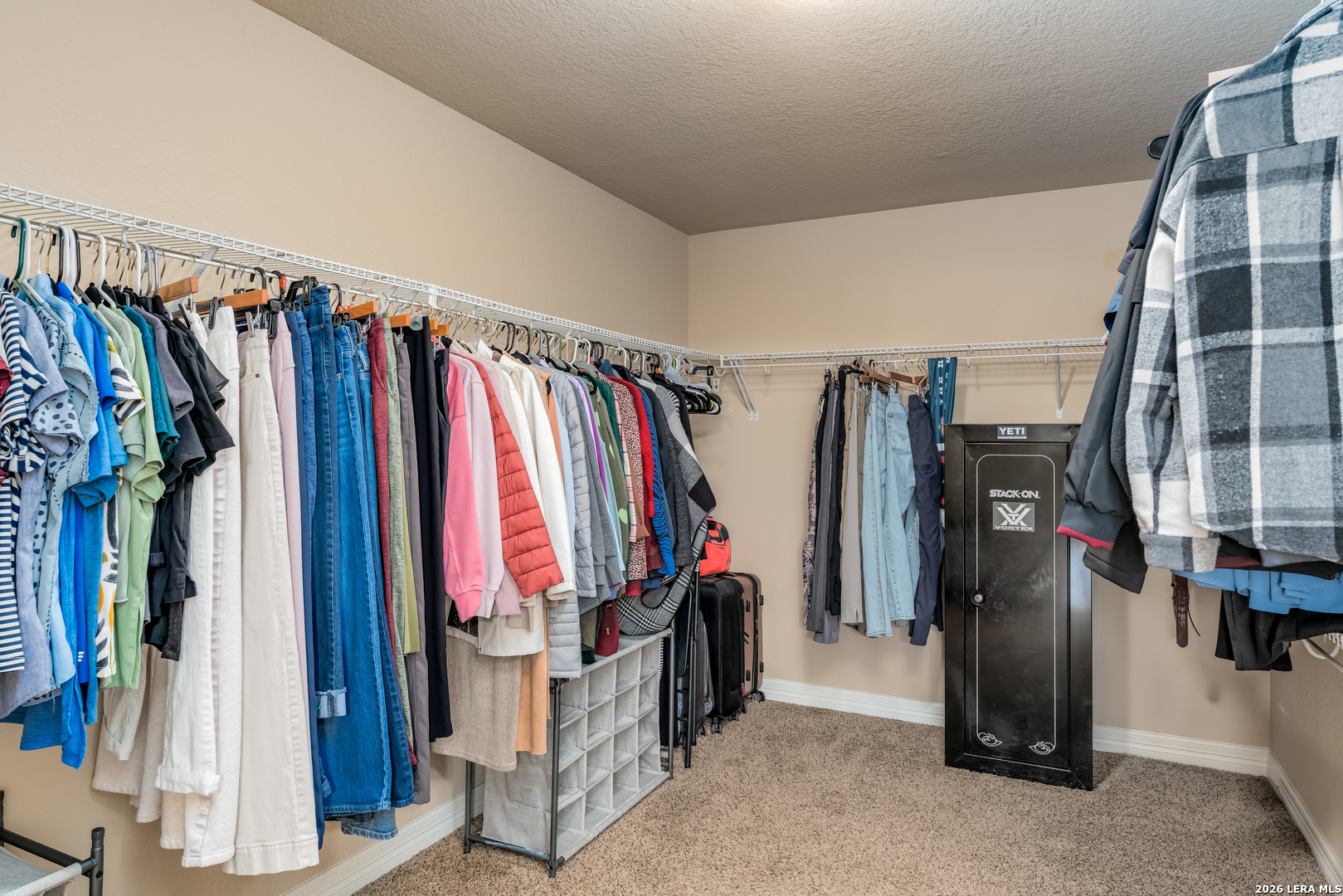 11331 Massive Mount Helotes, TX 78023 - Photo 23 of 43 a view of walk in closet with clothes