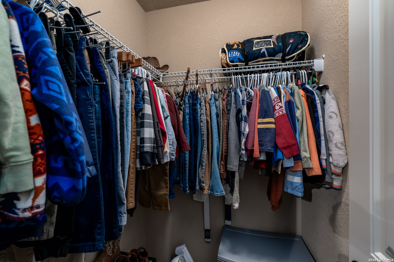 11331 Massive Mount Helotes, TX 78023 - Photo 32 of 43 a view of walk in closet with clothes and shoes