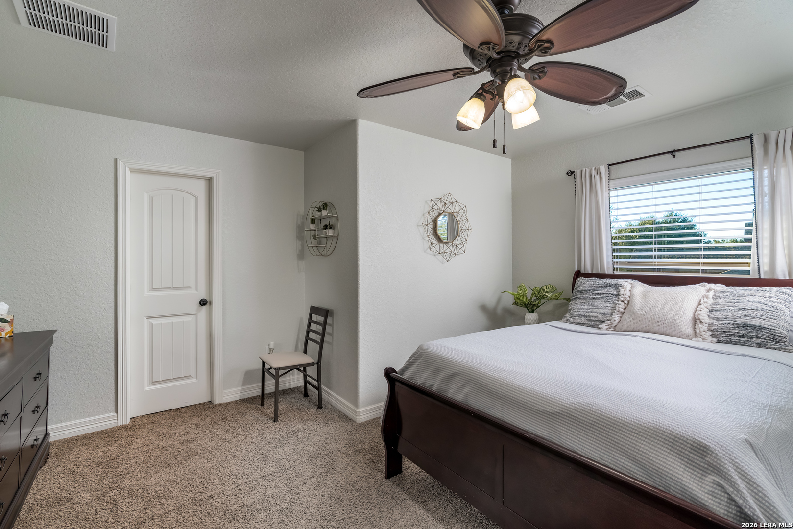 11331 Massive Mount Helotes, TX 78023 - Photo 36 of 43 a bedroom with a bed and a chandelier