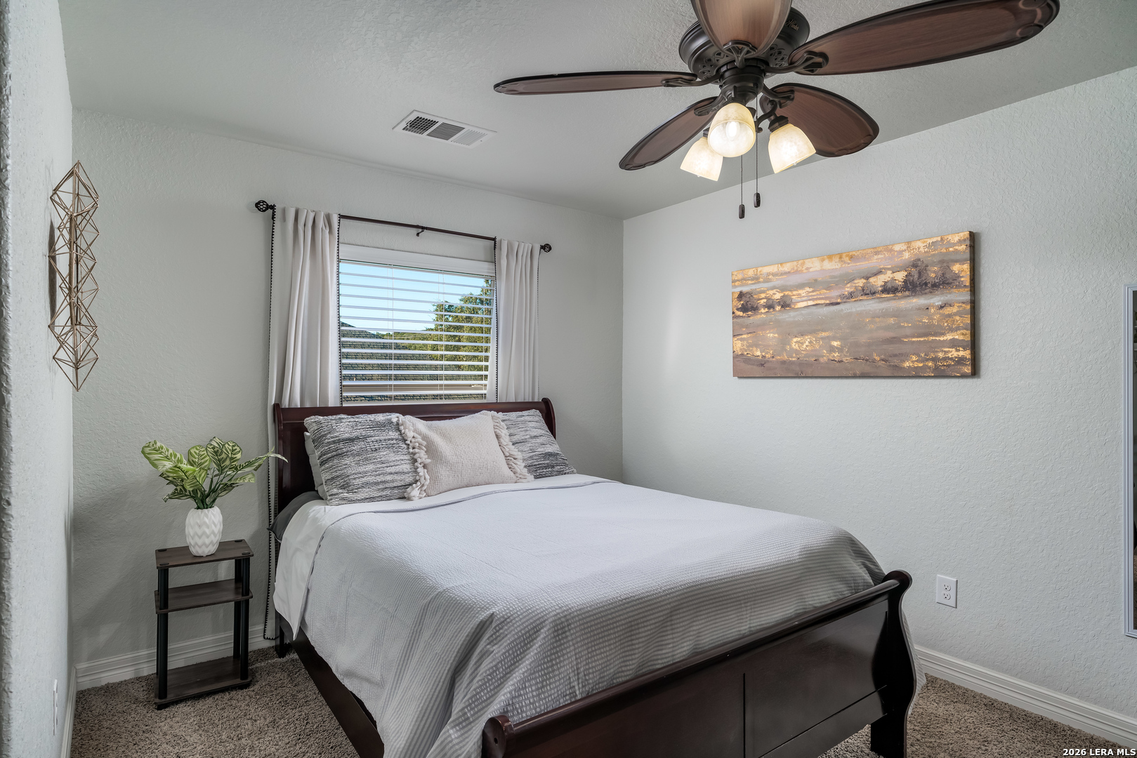 11331 Massive Mount Helotes, TX 78023 - Photo 37 of 43 a bedroom with a bed and a chandelier