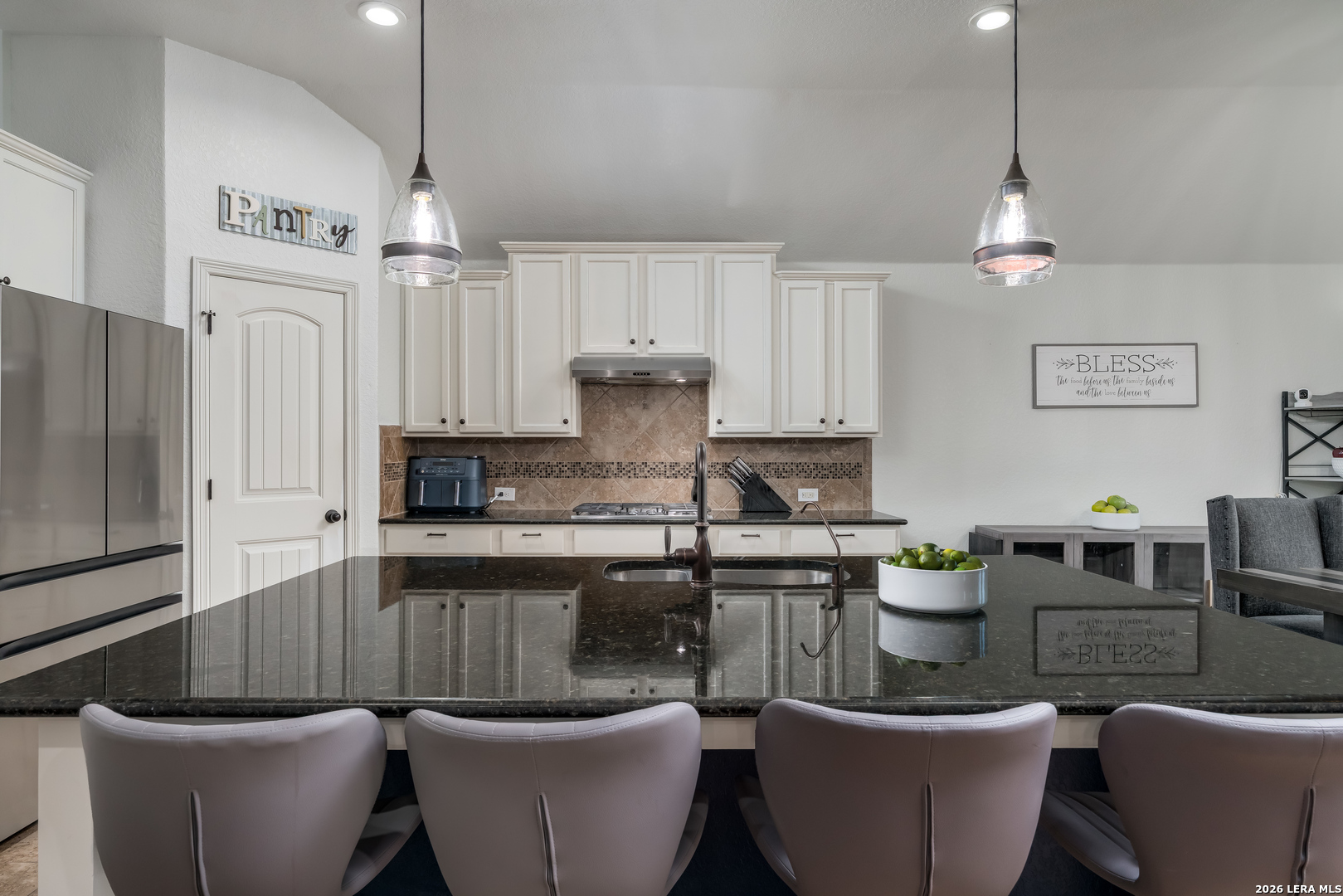 11331 Massive Mount Helotes, TX 78023 - Photo 10 of 43 a kitchen with a table and chairs