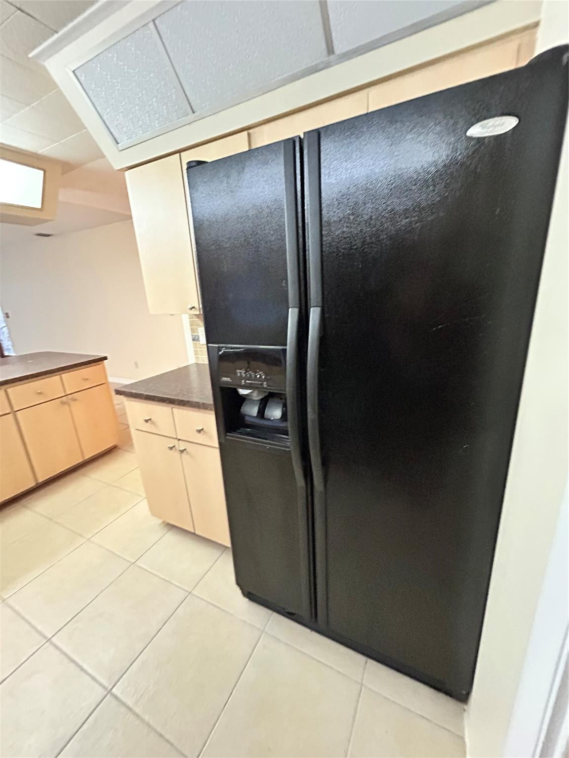 244 Southwest 3rd Place Dania Beach, FL 33004 - Photo 13 of 42 a view of a refrigerator in kitchen and an empty room