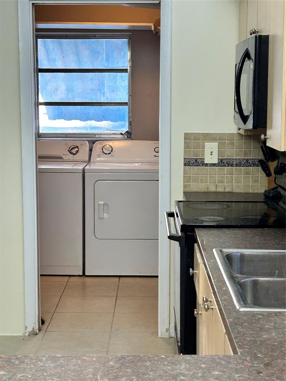 244 Southwest 3rd Place Dania Beach, FL 33004 - Photo 14 of 42 a utility room with dryer and washer
