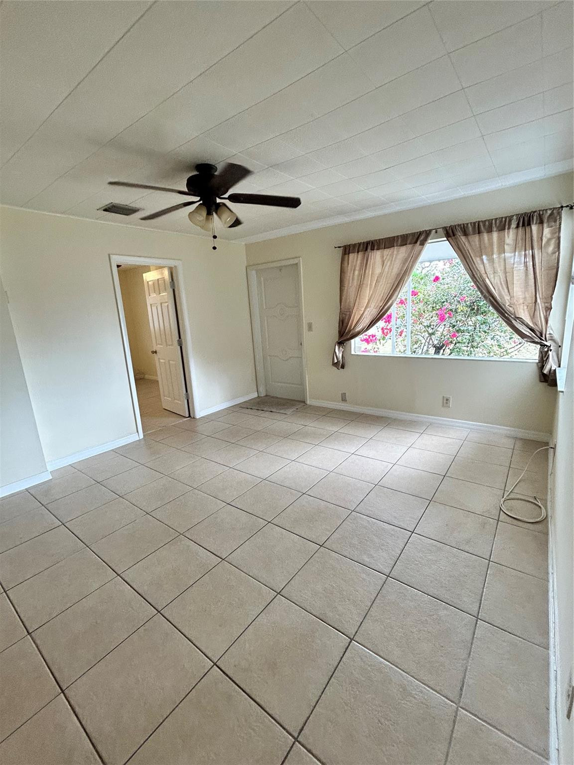 244 Southwest 3rd Place Dania Beach, FL 33004 - Photo 37 of 42 a view of a livingroom with furniture and a ceiling fan