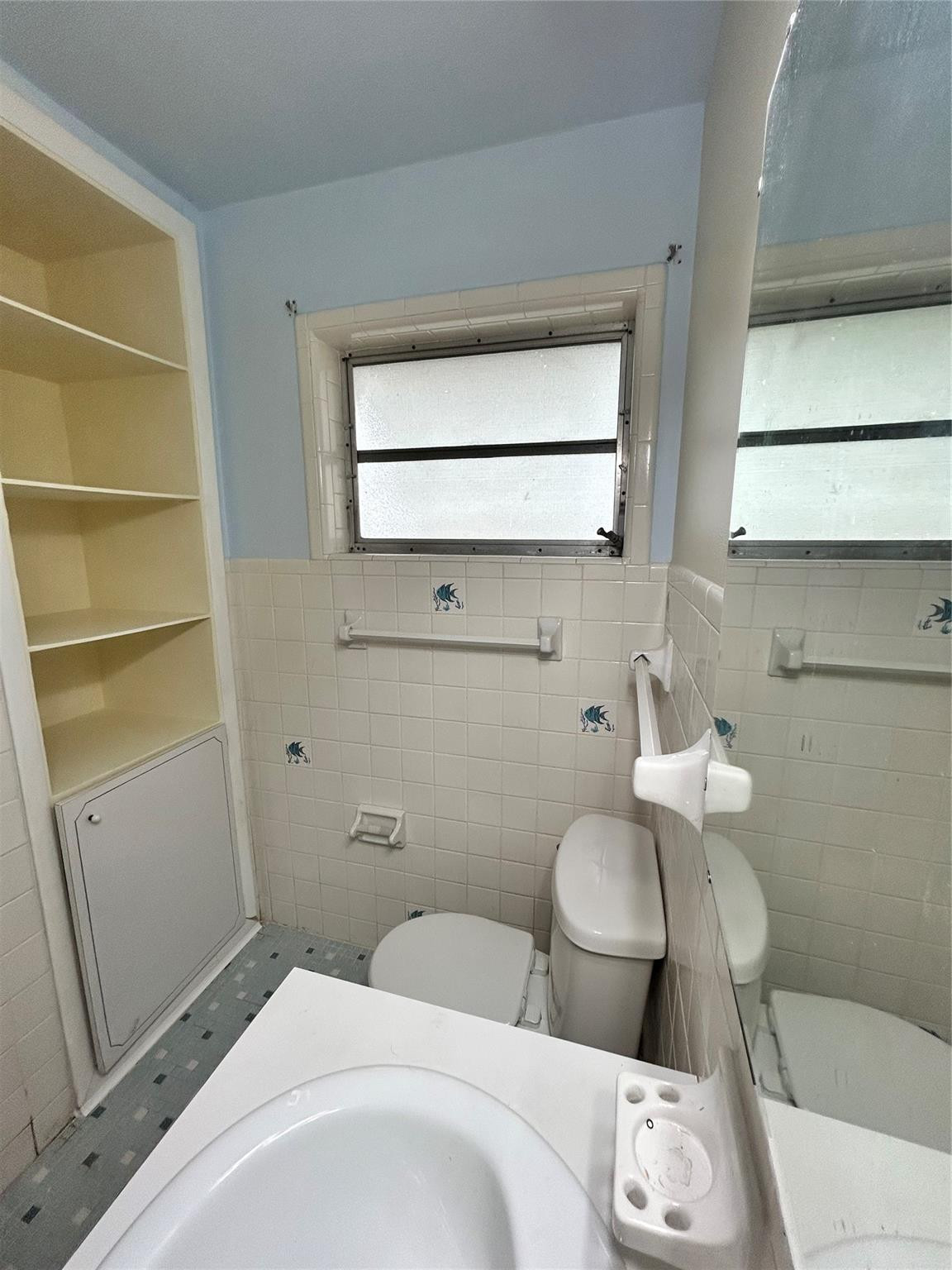 244 Southwest 3rd Place Dania Beach, FL 33004 - Photo 39 of 42 a bathroom with a toilet sink and mirror