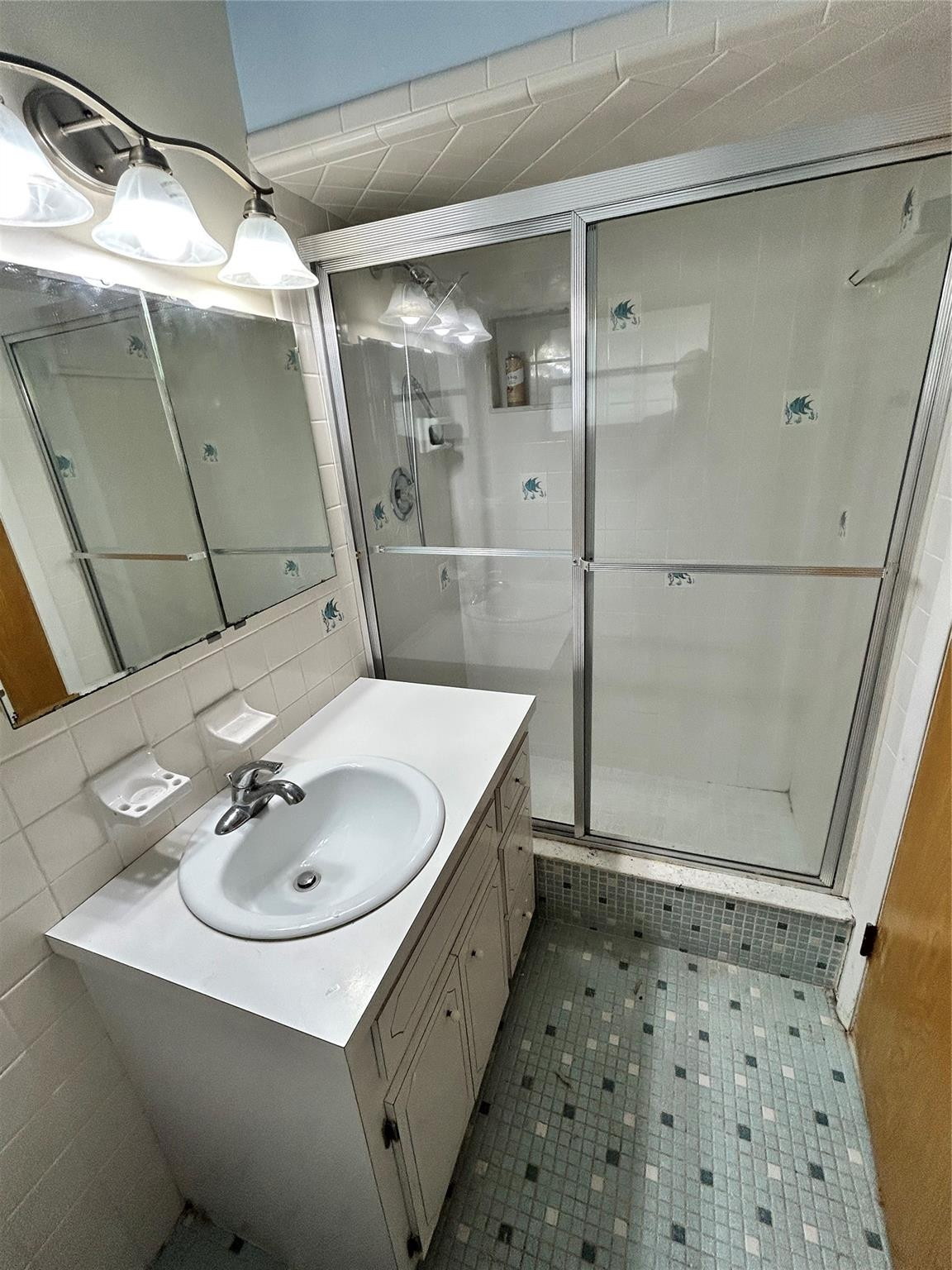 244 Southwest 3rd Place Dania Beach, FL 33004 - Photo 40 of 42 a bathroom with a sink and a mirror