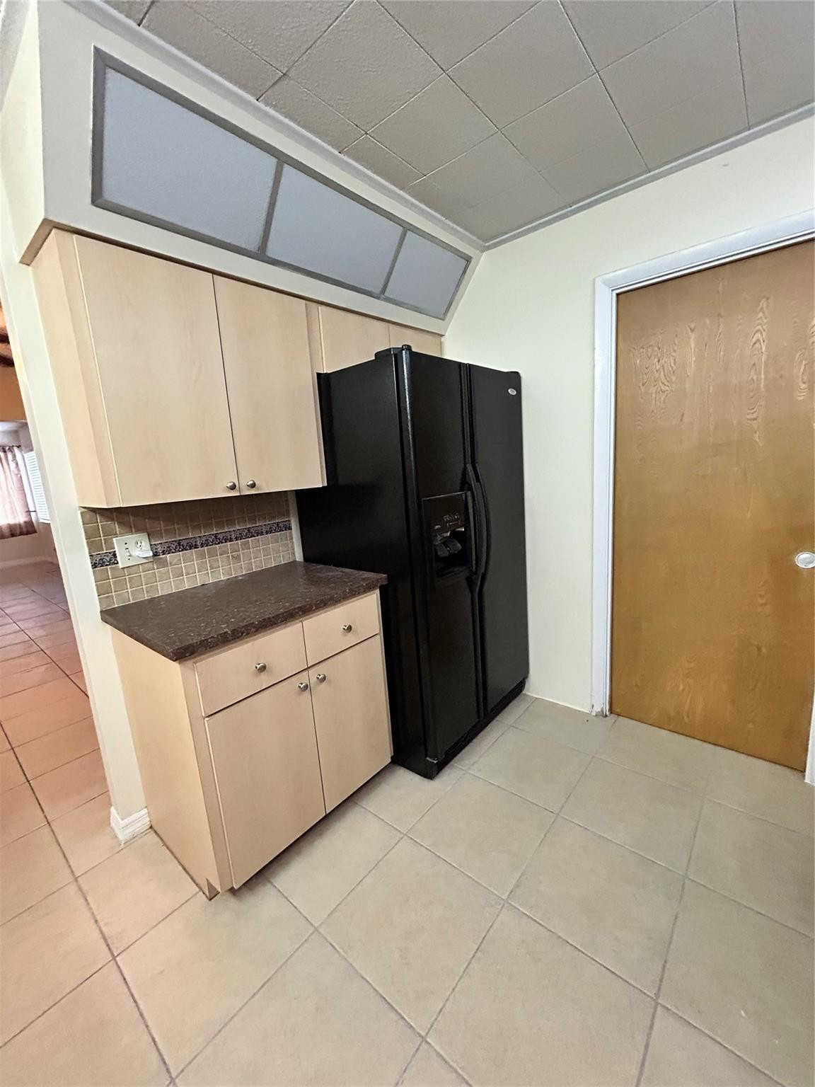 244 Southwest 3rd Place Dania Beach, FL 33004 - Photo 6 of 42 a kitchen with white cabinets and black appliances