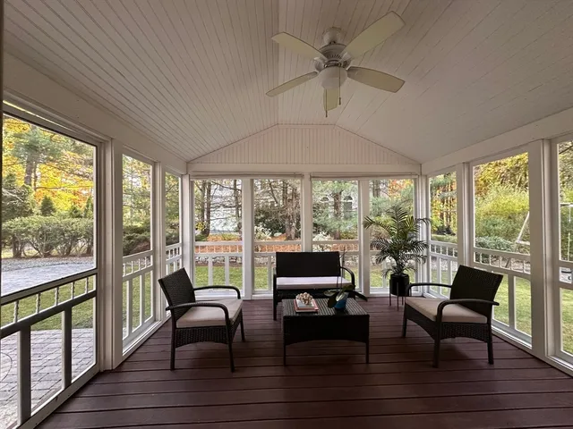 a view of a hallway view with wooden floor and furniture