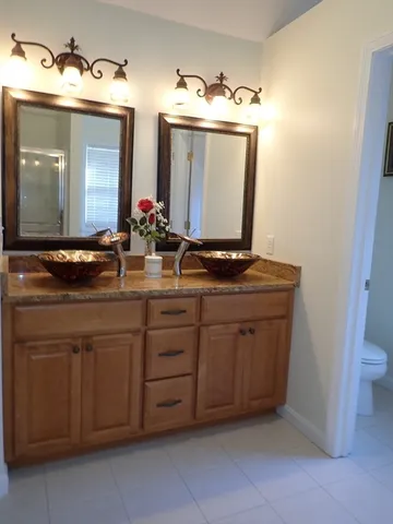 a bedroom with a bed and a view of bedroom