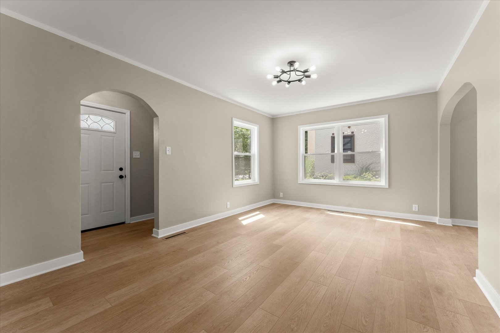 305 South Fair Street Champaign, IL 61821 - Photo 5 of 41 a view of an empty room with a window and wooden floor