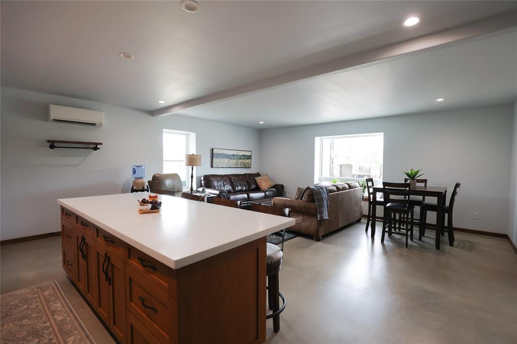 1250 County Road Brady, TX 76825 - Photo 16 of 40 a large white kitchen with a table and chairs
