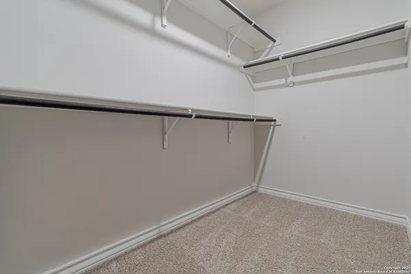 a view of an empty walk in closet