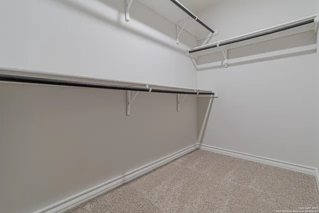 a view of an empty walk in closet