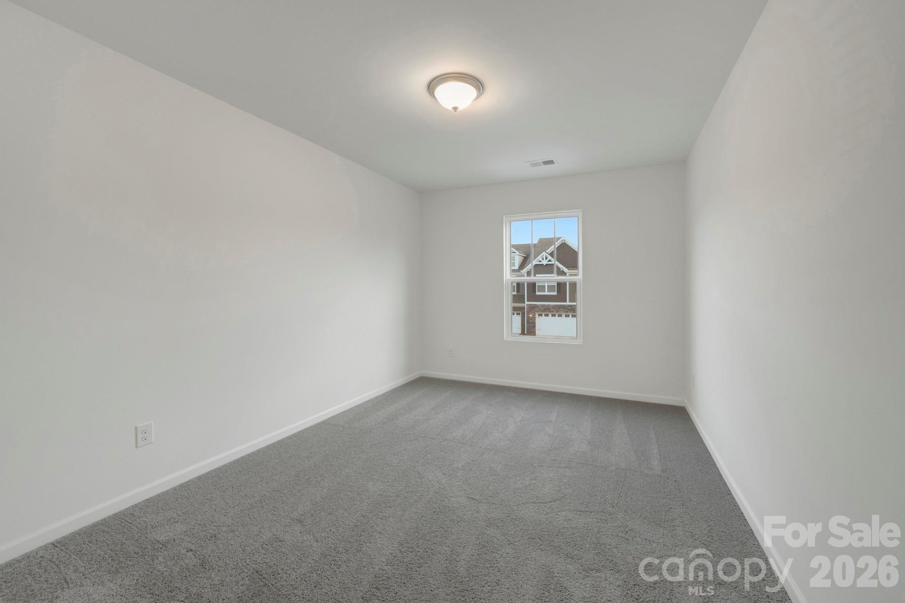 1138 Overbrook Place Wingate, NC 28174 - Photo 13 of 22 an empty room with windows and entrance