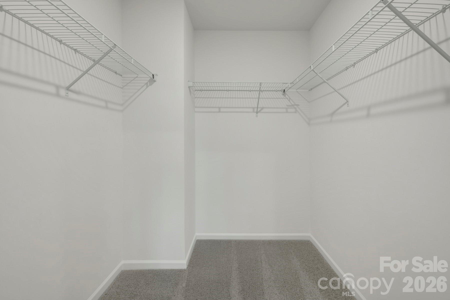 1138 Overbrook Place Wingate, NC 28174 - Photo 20 of 22 a view of a room with racks on the wall