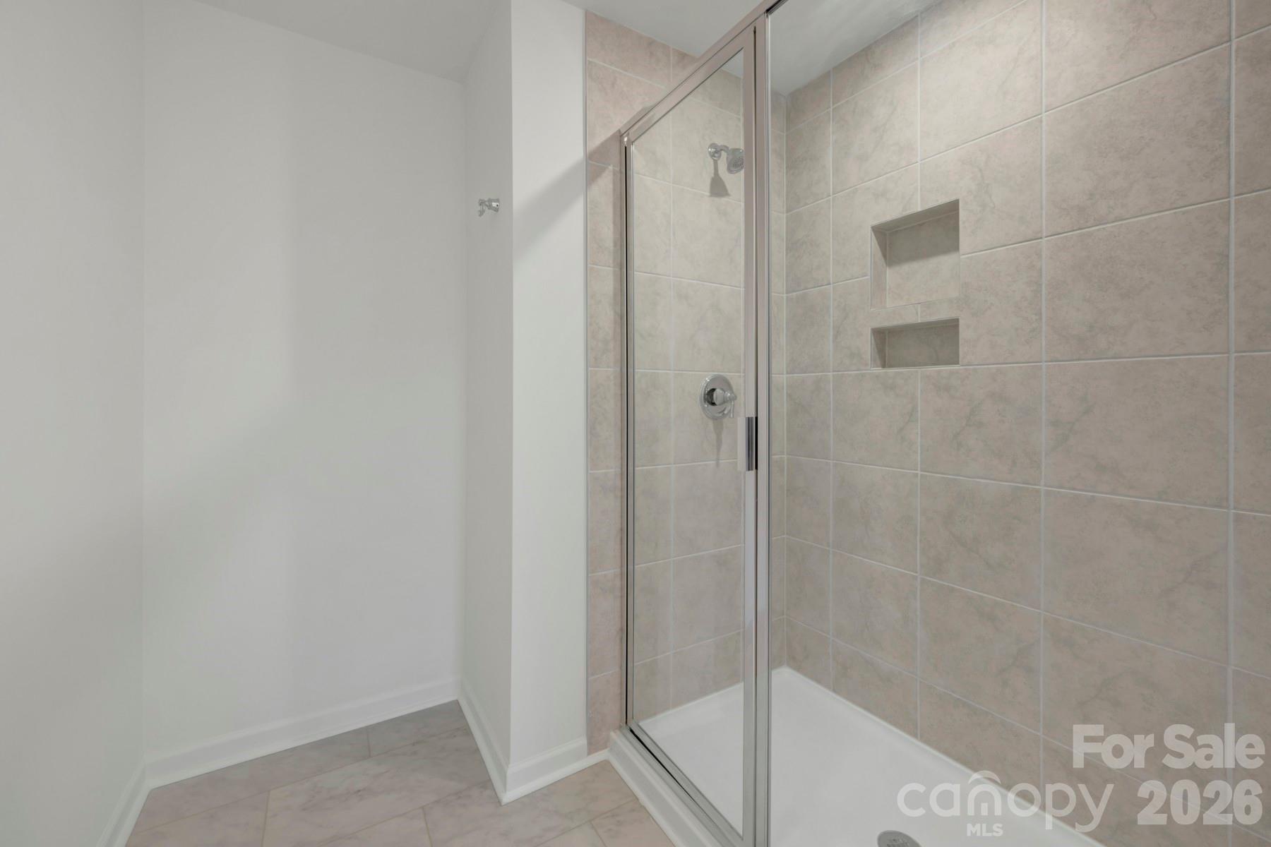 1138 Overbrook Place Wingate, NC 28174 - Photo 21 of 22 a bathroom with a shower