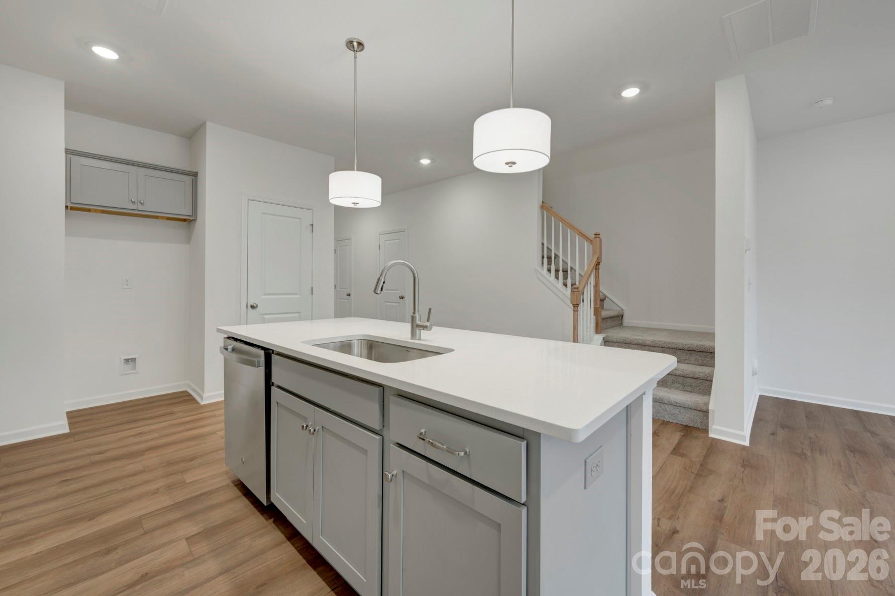 1138 Overbrook Place Wingate, NC 28174 - Photo 4 of 22 a kitchen with a sink cabinets and wooden floor