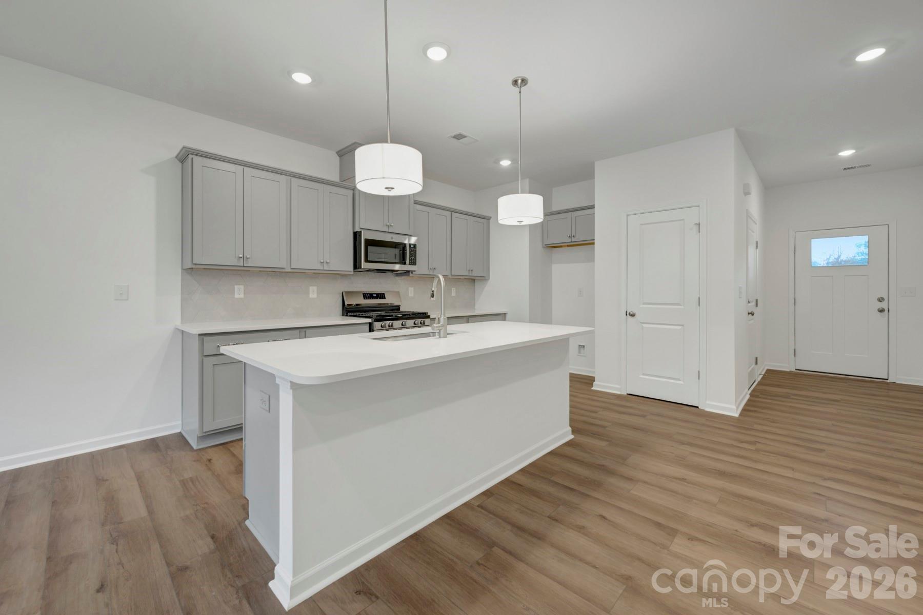 1138 Overbrook Place Wingate, NC 28174 - Photo 6 of 22 a view of a kitchen with a sink stainless steel appliances and cabinets
