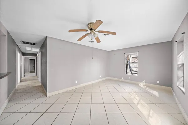 a view of an empty room with a window