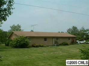 5403 Griffith Road Monroe, NC 28112 - Photo 2 of 3 a front view of a house with a garden