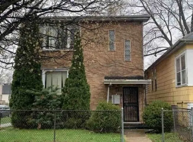 a view of house with yard