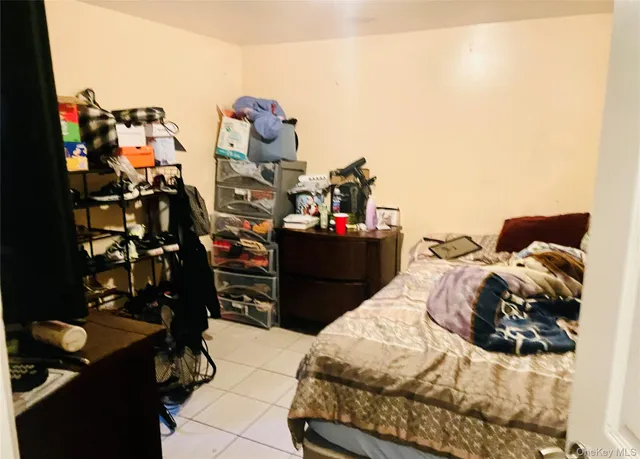 a bedroom with a bed and a closet