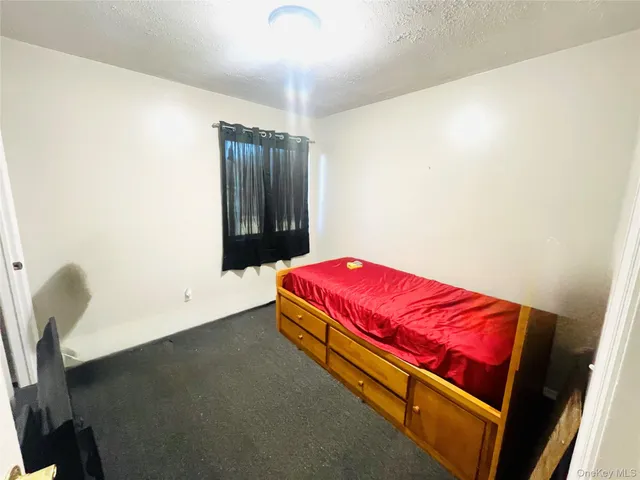 a room with a bed and a window